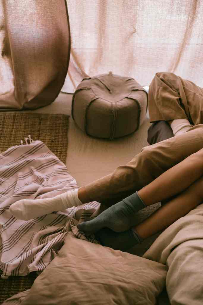 Women relaxing comfortably, reflecting the importance of rest and comfort for health and wellbeing.